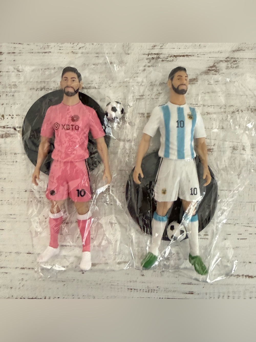 2 soccer player figures